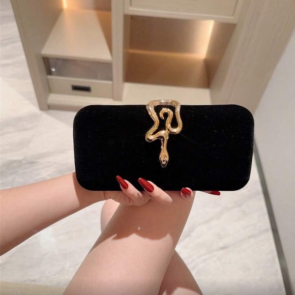 Elegant Black Clutch with Gold Snake Design Accent